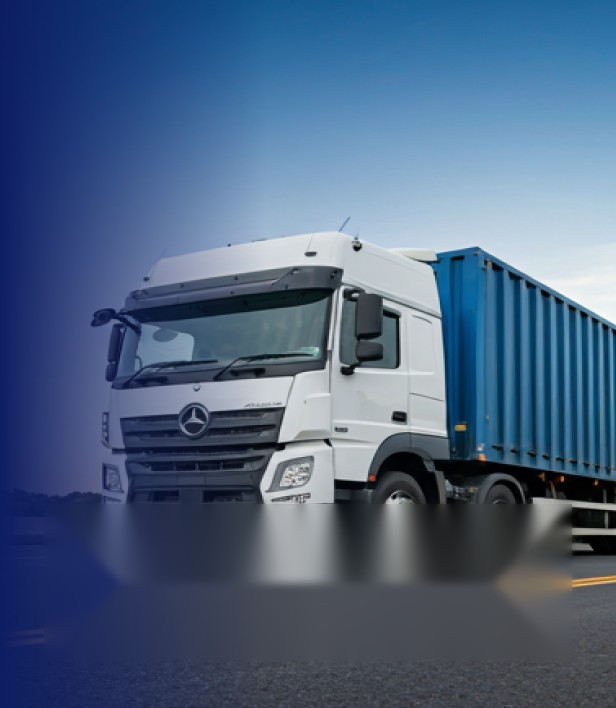 White Saigon Trans truck with a blue container on the road